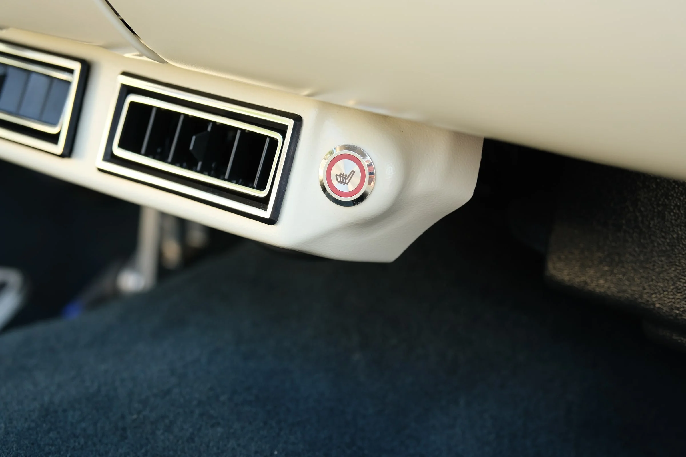 Heated seat button